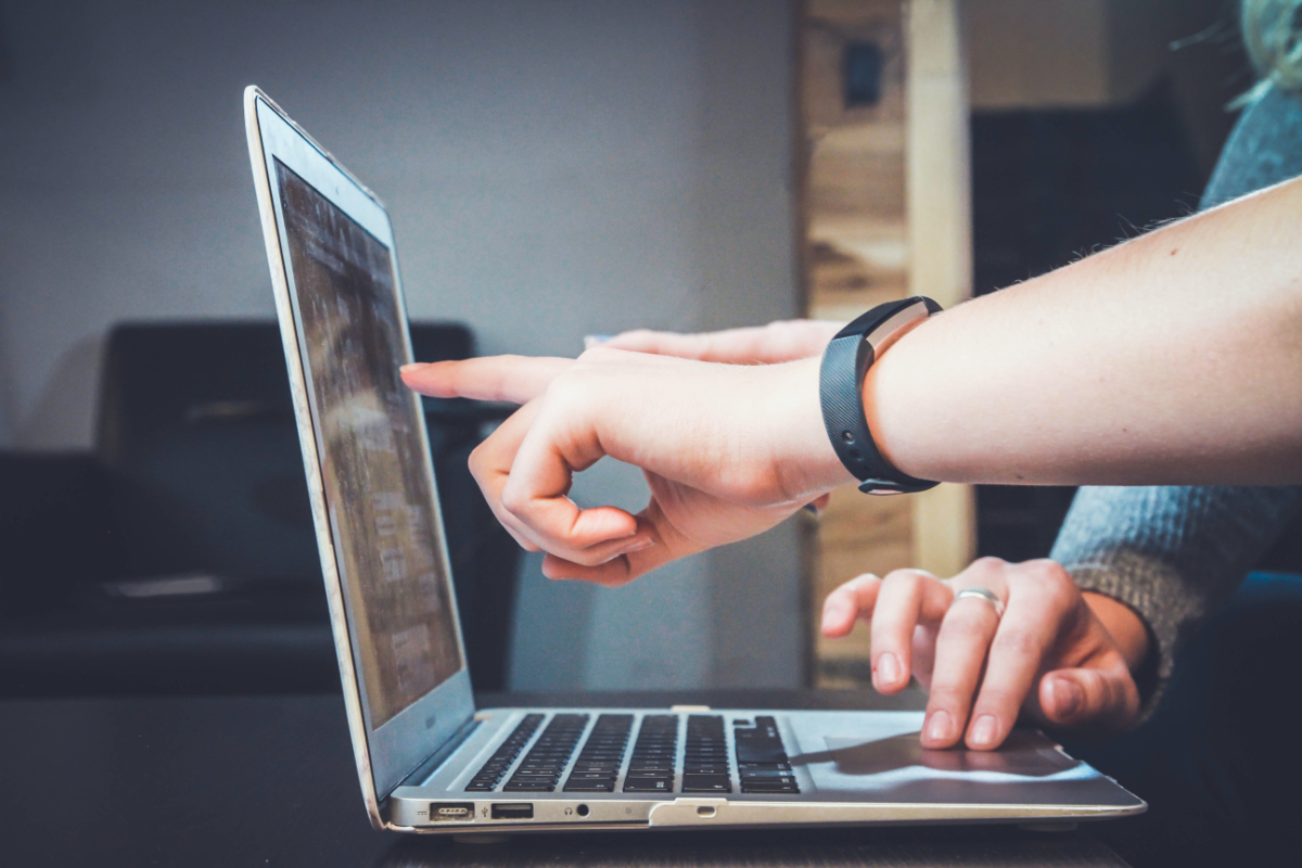 Two People Working On Computer